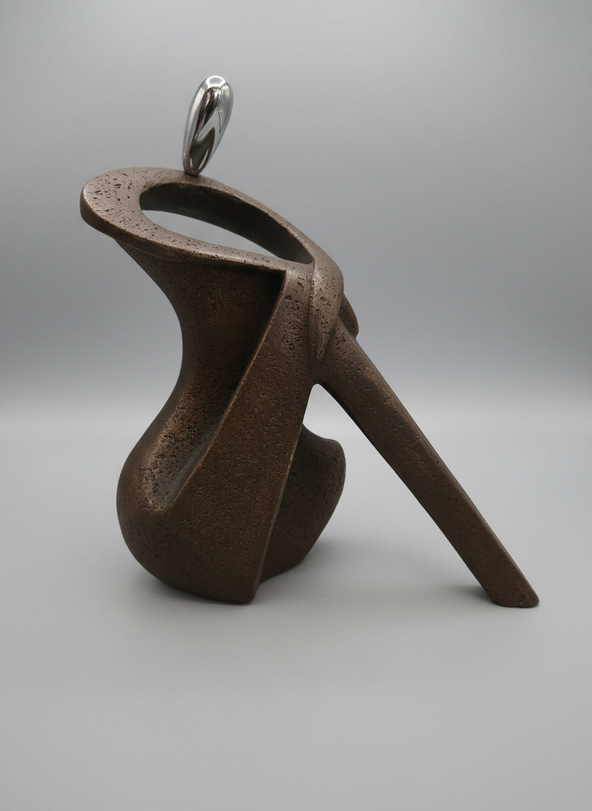 Silver Serenity – Seated Figurine